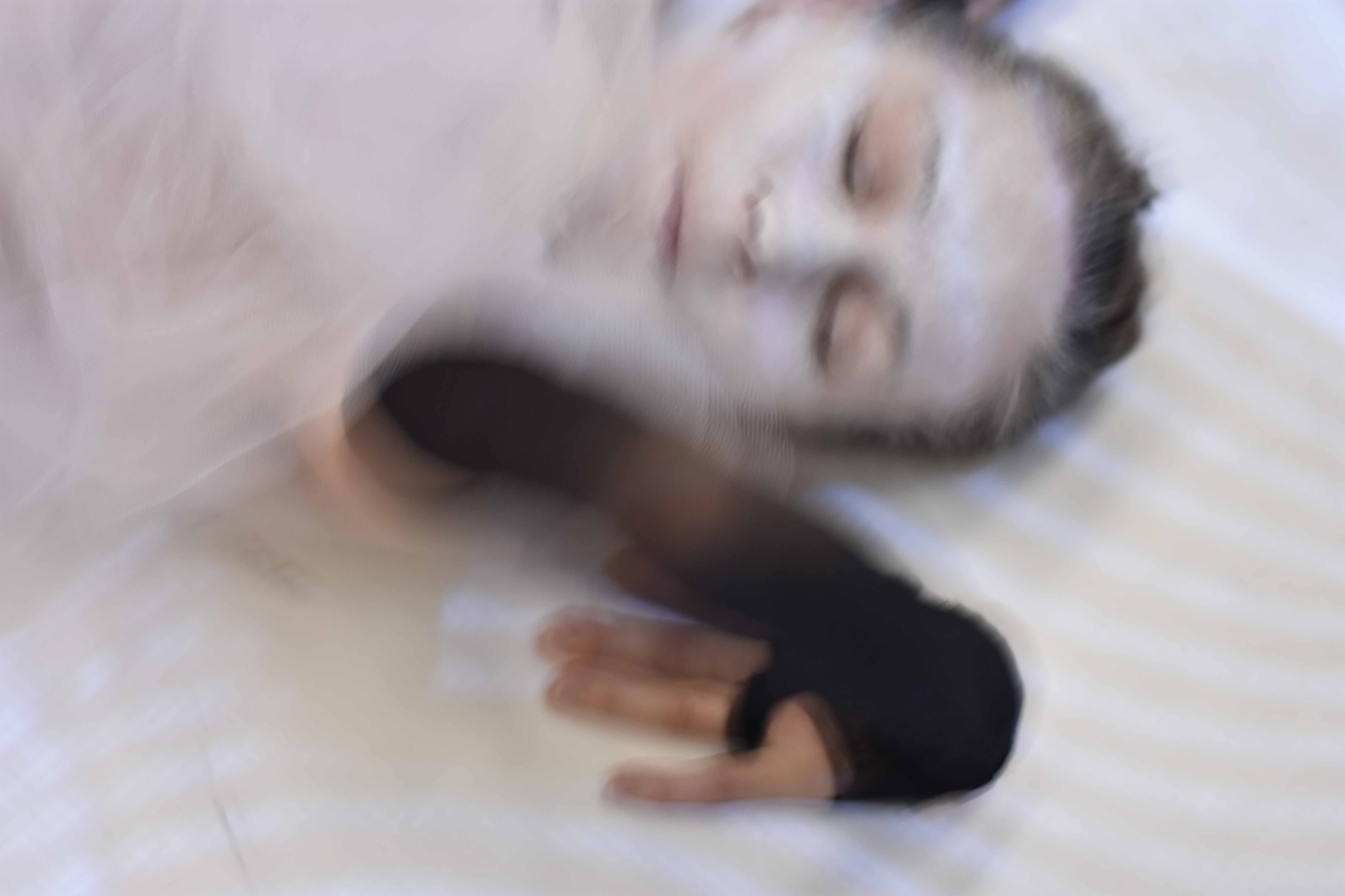 Flesh being, Carmen Olsson dance and choreography. The image depicting Carmen Olsson wearing white make-up. Photo: Olle Johansson